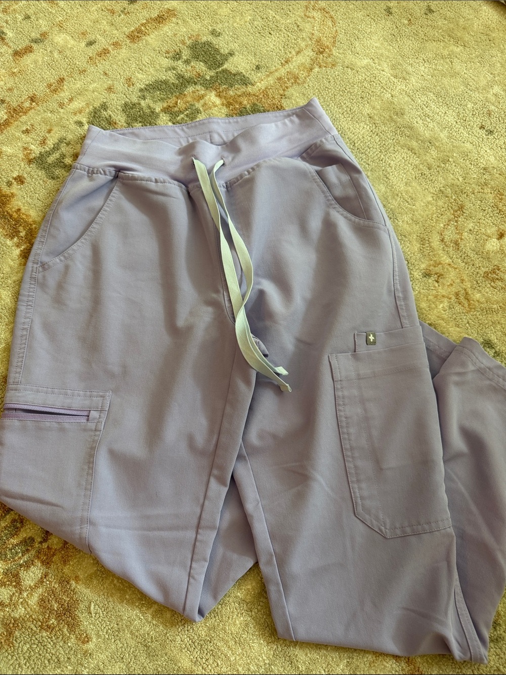 FIGS lavender/lilac scrub pants with light gray drawstring